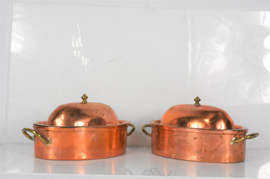 Copper Pot Grouping: Grouping includes (2) unmarked lidded copper pots measuring approx. 12.25" (including handles) and 6.25"h (including lid)