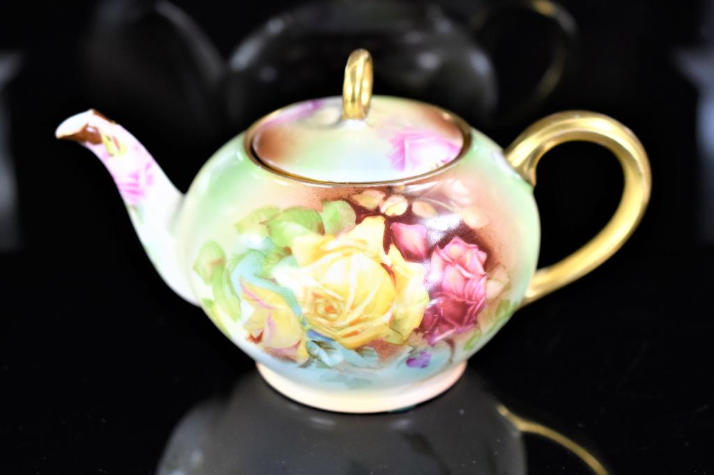 Signed Rose Sevres Bavarian Porcelain Teapot: Porcelain Bavarian Tea Pot with Hand-Painted "Marechal Niel" Rose. Marked "Thu. E. Mr. Sevres Bavaria" on bottom of Pot. Glazing is even and smooth with Good Coloration on Flowers. Very faint crack vi