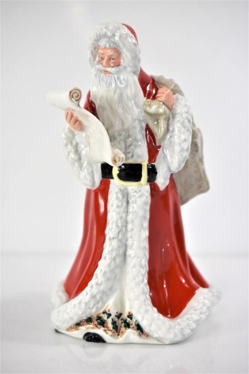 Signed Royal Doulton Porcelain Father Christmas: Father Christmas holding his "Naughty & Nice" list. Designed by Artist Robert Tabbenor and Issued 1992-99. Measures approx. 9" Tall. Marked "HN 3399" and Royal Doulton Mark printed with "Hand Made and