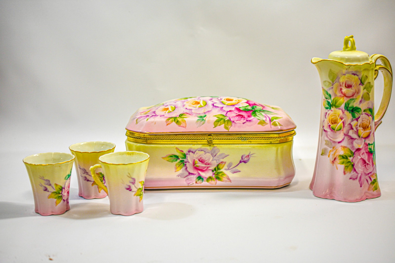 Nippon Dresser Box and Chocolate Pot Grouping: Grouping includes (5) pieces including (1) large porcelain dresser box, (1) chocolate pot, and (3) cups. Dresser box measures approx. 10.5" long