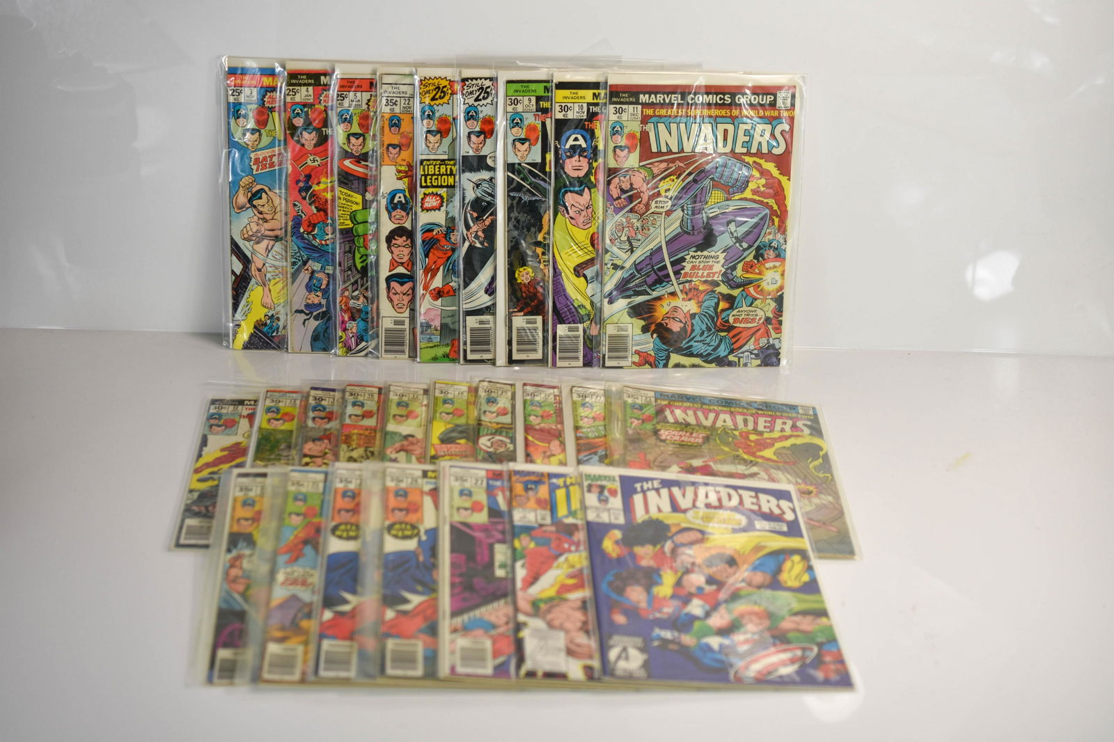 Invaders Assorted Comic Groupuing: Grouping includes (25+) Invaders assorted comics including Cap vs Namor, Hitler, bondage, and more. Comics appear to be in very good to near mint condition.