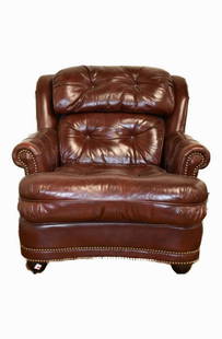 Leather Lounge Chair: Tufted leather chair with brass tacking Provenance: Bethlehem, PA Estate. Size: 33.5"w x 34"h.