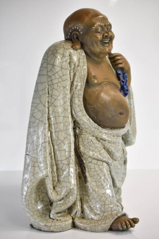 Large Chinese Mudman Buddha: Includes a large mudman Buddha, appear to be antique, in excellent condition. There was a repair to the robe above the right foot. Weighs approx. 20lbs. Measures approx. 18.5"h by 14"w by 11"lProvenan