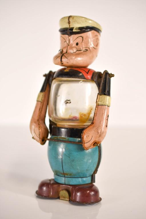 Line Mar Toys Stamped Metal Popeye Lantern Lamp: Antique Stamped Metal Lantern in the Form of Popeye. Glass Lantern Center. Shows some Paint wear and oxidation as shown in photos. Glass Lantern center operates on one "D" cell battery. Arms are joint