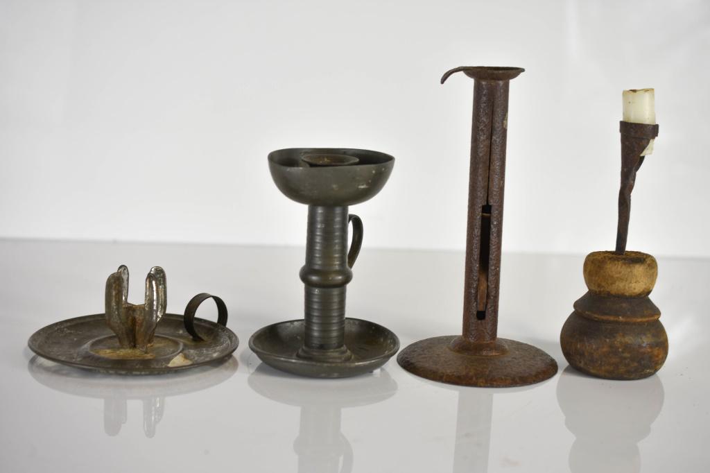 Antique Candle Holder Grouping: Grouping of (4) Antique Candle Holders including Sheet Steel Holders and Primitive Wooden & Steel Holder. All Pieces Show Oxidation and Wear Consistent with theirage. Largest piece measures approx. 7.