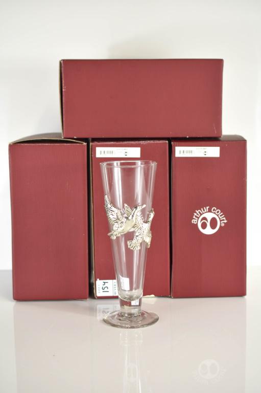 Arthur Court Duck Pilsner Glass Grouping: Grouping includes (4) Arthur Court duck pilsner glasses with orignal boxes. Each glass has a pair of mounted metal flying ducks. Measure approx. 9"w by 3"h