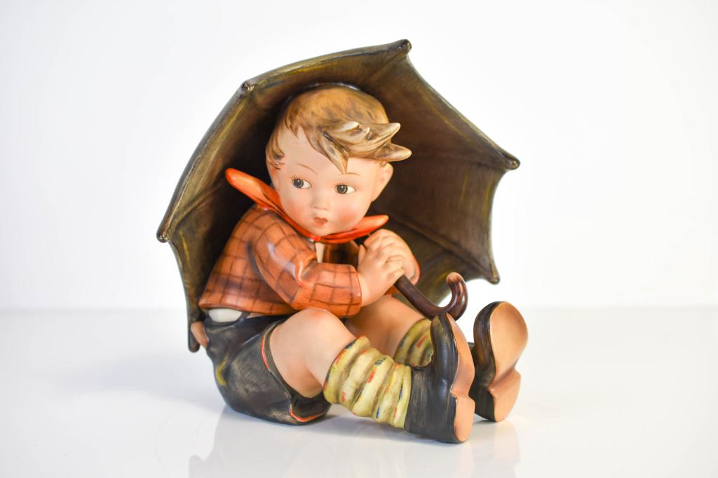 Hummel Boy & Girl Umbrella 152 8" Collection of 2: Includes (2) Girl is marked with Bee in V, 152/B. W Goebel Germany. Boy is marked Bee in V, 152 A, Germany and looks like it may be an incised 86, but cannot be certain. Both are 8" in height.