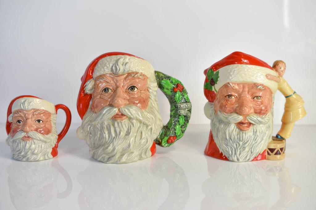 Royal Doulton Santa Claus Mugs Collection of 3: Includes 3 Toby mugs. Tallest Toby mug is 7 3/4" in height.