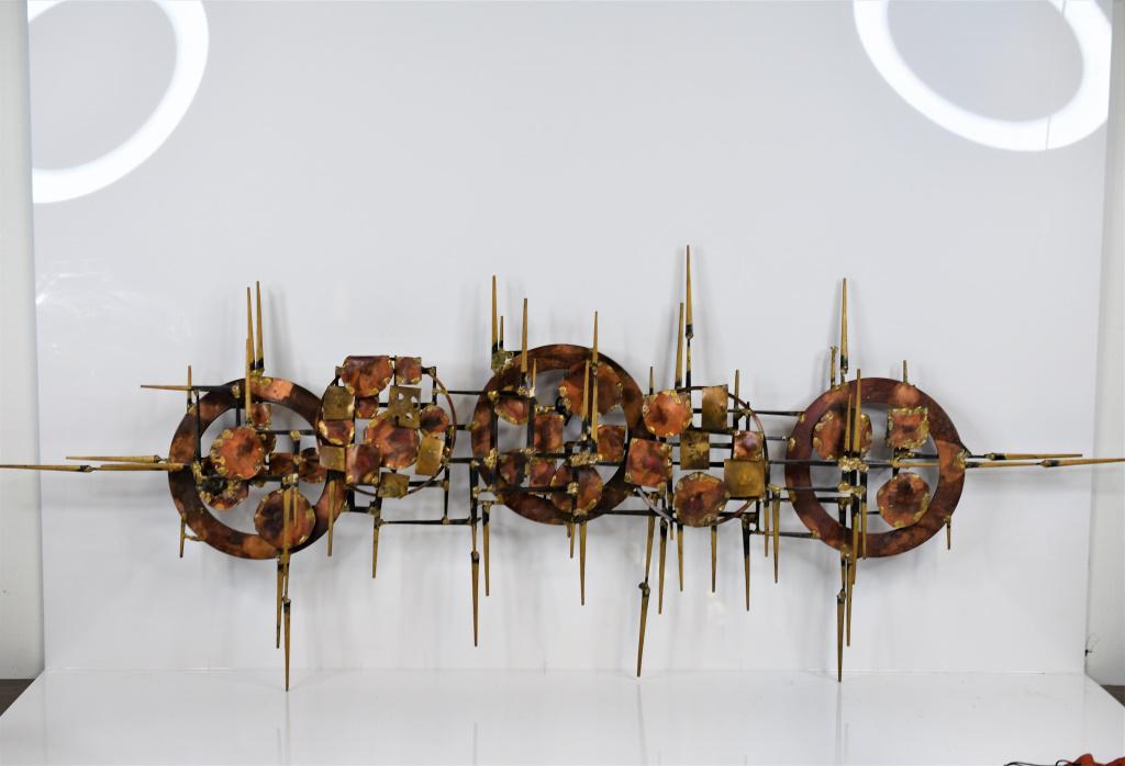 Mid-Century Modern Mixed Metal Wall Sculpture: Mid-Century Modern wall circles & squares sculpture in the style of William Bowie, Henrik Horst. Measures approx. 51.5"l x 20.5"h x 3.5"w.