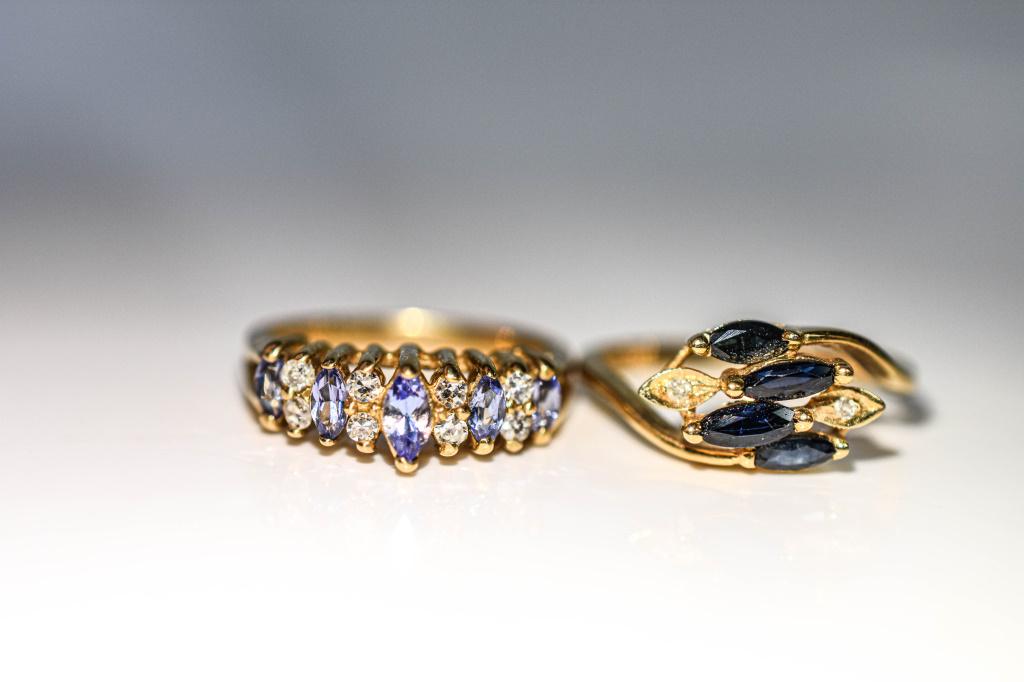 14K Gold with Tanzanite Blue Sapphire Rings: 14k Yellow Gold Rings, Containing Blue Sapphires With Diamonds, And A Row Of Tanzanite With Diamonds; Ring Sizes 7, And -1/4, 4.11 dwt, including stones.
