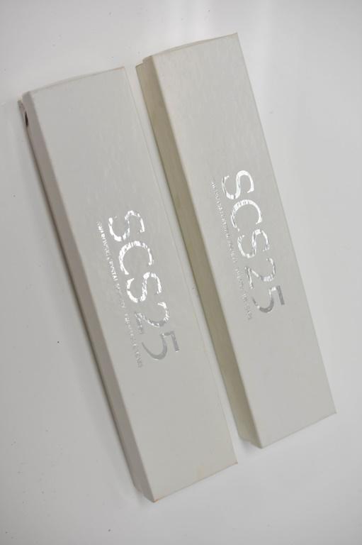 Swarovski Chopstick Grouping: Grouping includes (2) pairs of Swarovski chopsticks and rests. Includes original boxes.