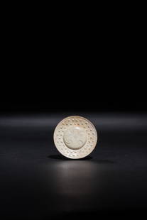 A JADE SWORD POMMEL SLIDE, HAN DYNASTY: 漢 雲紋玉劍首A JADE SWORD POMMEL SLIDE, HAN DYNASTYD. 4.6