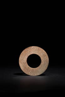 A CELADON JADE DISC, MING DYNASTY: A CELADON JADE DISC, MING DYNASTY明 青白玉榖紋玉璧,D. 10.8 cm