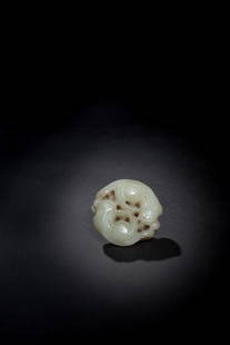 A CELADON JADE BADGERS PENDANT: A CELADON JADE 'BADGERS' PENDANT青白玉雙歡珮