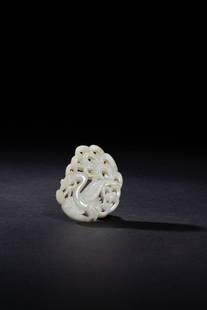 A CELADON JADE PHONEIX PENDANT: A CELADON JADE 'PHONEIX' PENDANT玉鳳珮