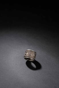 A SILVER ARCHER'S RING, QING DYNASTY: A SILVER ARCHER'S RING, QING DYNASTY 清 足銀轉心花卉圖扳指