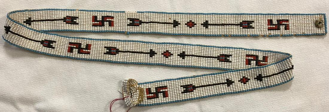 NATIVE AMERICAN BEADWORK BELT: NATIVE AMERICAN BEADWORK BELT IN RED, WHITE, BLUE & BLACK BEADS W/ WHIRLING LOGS & ARROWS