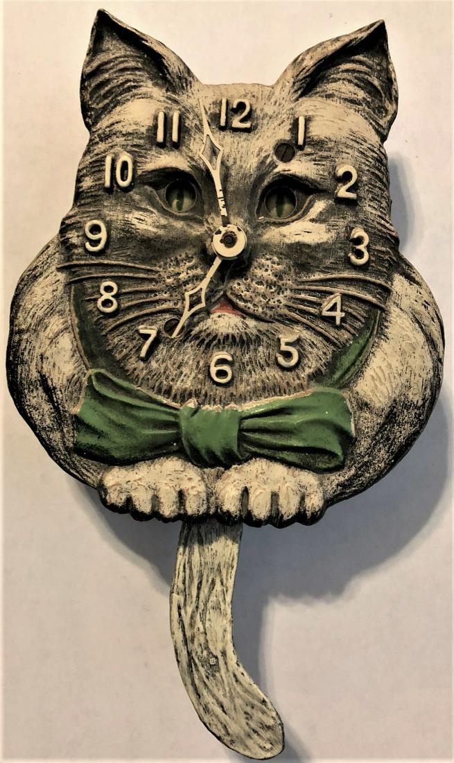 LUX ANIMATED WHITE / BLACK CAT PENDULETTE CLOCK: LUX PENDULETTE ANIMATED WHITE / BLACK CAT WALL CLOCK WITH MOVING EYES AND TAIL - LUX CLOCK MFG. CO. WATERBURY CONN. U.S.A. - NO. 325 CIRCA 1933 - 4 3/8" X 7 1/2"