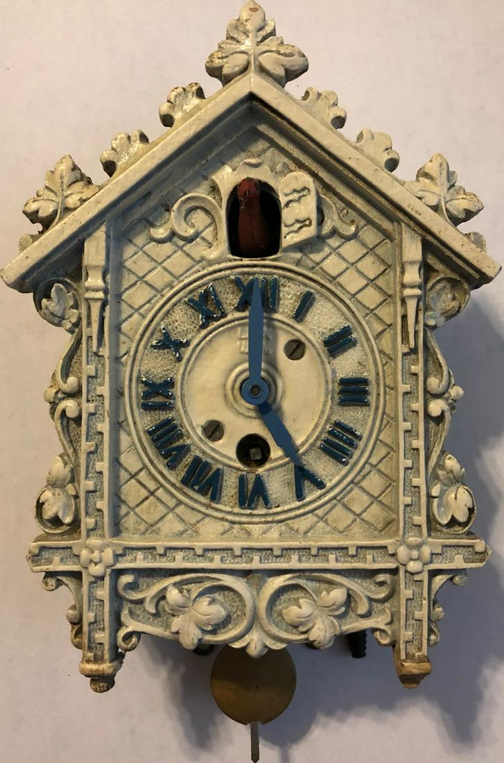 LUX ELABORATE WHITE OLD CUCKOO STYLE PENDULETTE CLOCK: LUX ELABORATE WHITE OLD CUCKOO STYLE PENDULETTE WALL CLOCK W/ RED BIRD - LUX CLOCK MFG. CO. WATERBURY CONN. U.S.A. - NO. 311 CIRCA 1933 - 1956 - 4 1/2" X 7"