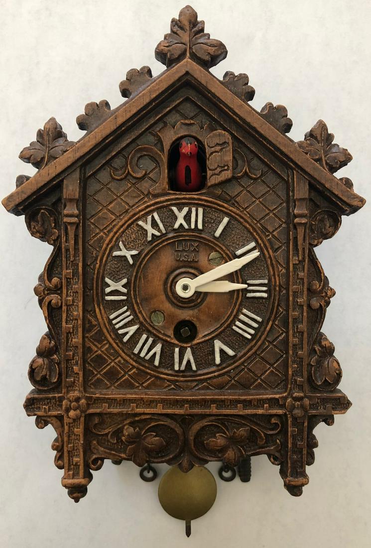 LUX ELABORATE BROWN CUCKOO STYLE PENDULETTE CLOCK: LUX ELABORATE BROWN OLD CUCKOO STYLE PENDULETTE WALL CLOCK W/ RED BIRD - LUX CLOCK MFG. CO. WATERBURY CONN. U.S.A. - NO. 311 CIRCA 1933 - 1956 - 4 1/2" X 7"