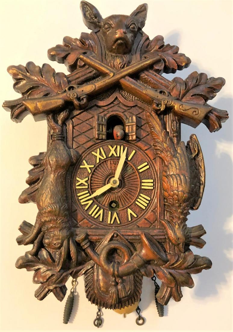 LUX ANIMATED HUNTING SCENE PENDULETTE WALL CLOCK: LUX ANIMATED HUNTING / GAME SCENE WITH DOG, GUNS, RABBIT, PHEASANT - PENDULETTE WALL CLOCK - NO. 315 CIRCA 1937 - 1956 - 5 3/4" WIDE X 9 1/2" HIGH