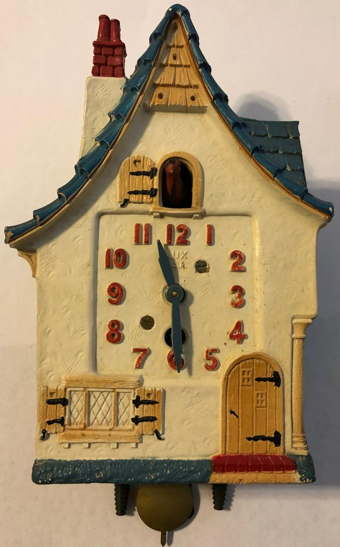 LUX ANIMATED DUTCH COTTAGE PENDULETTE CLOCK: LUX ANIMATED DUTCH COTTAGE STYLE PENDULETTE WALL CLOCK W/ BLUE ROOF - LUX CLOCK MFG. CO. WATERBURY CONN. U.S.A. - NO. 380 CIRCA 1938 - 4 1/4" X 7 1/2"