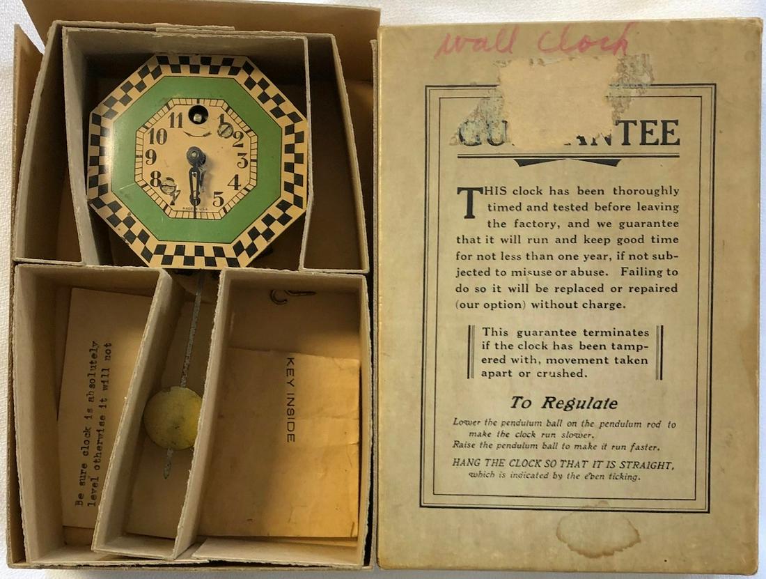 KEEBLER OCTAGONAL CHECKERED PENDULETTE CLOCK: KEEBLER CLOCK CO. GREEN, BLACK AND WHITE CHECKERED BORDER PENDULETTE WALL CLOCK - NO. 210 CIRCA 1930 - 2 3/4" X 5 1/2"
