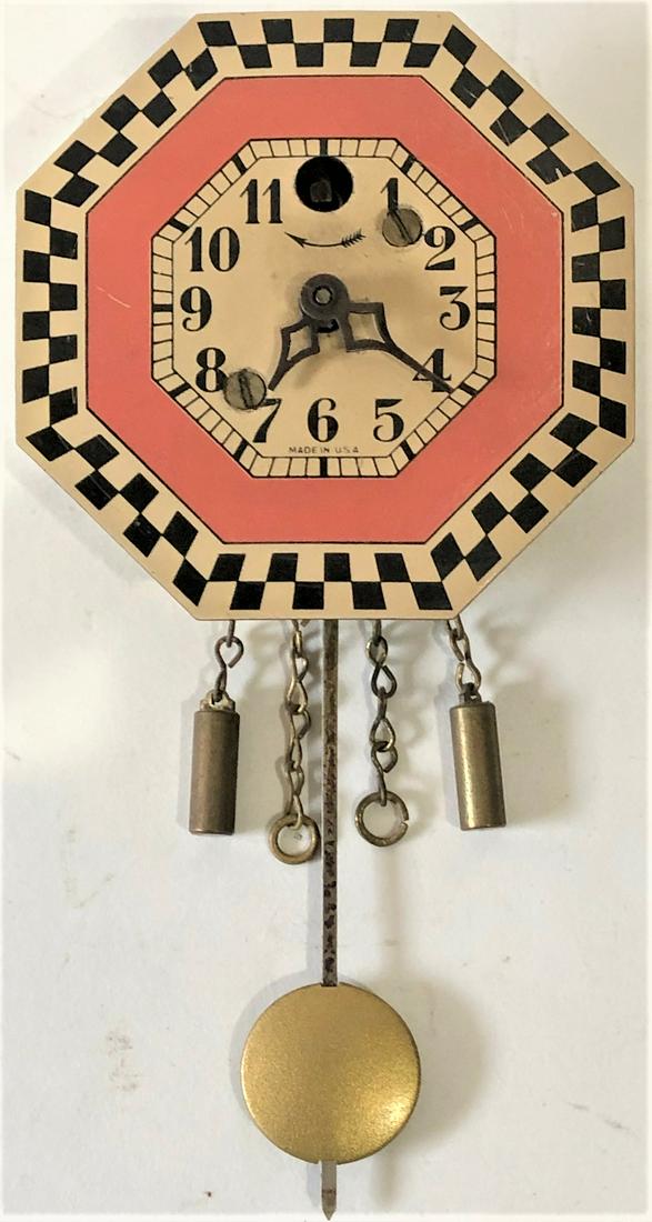 KEEBLER OCTAGONAL CHECKERED PENDULETTE CLOCK: KEEBLER CLOCK CO. PINK, BLACK AND WHITE CHECKERED BORDER PENDULETTE WALL CLOCK - NO. 210 CIRCA 1930 - 2 3/4" X 5 1/2"