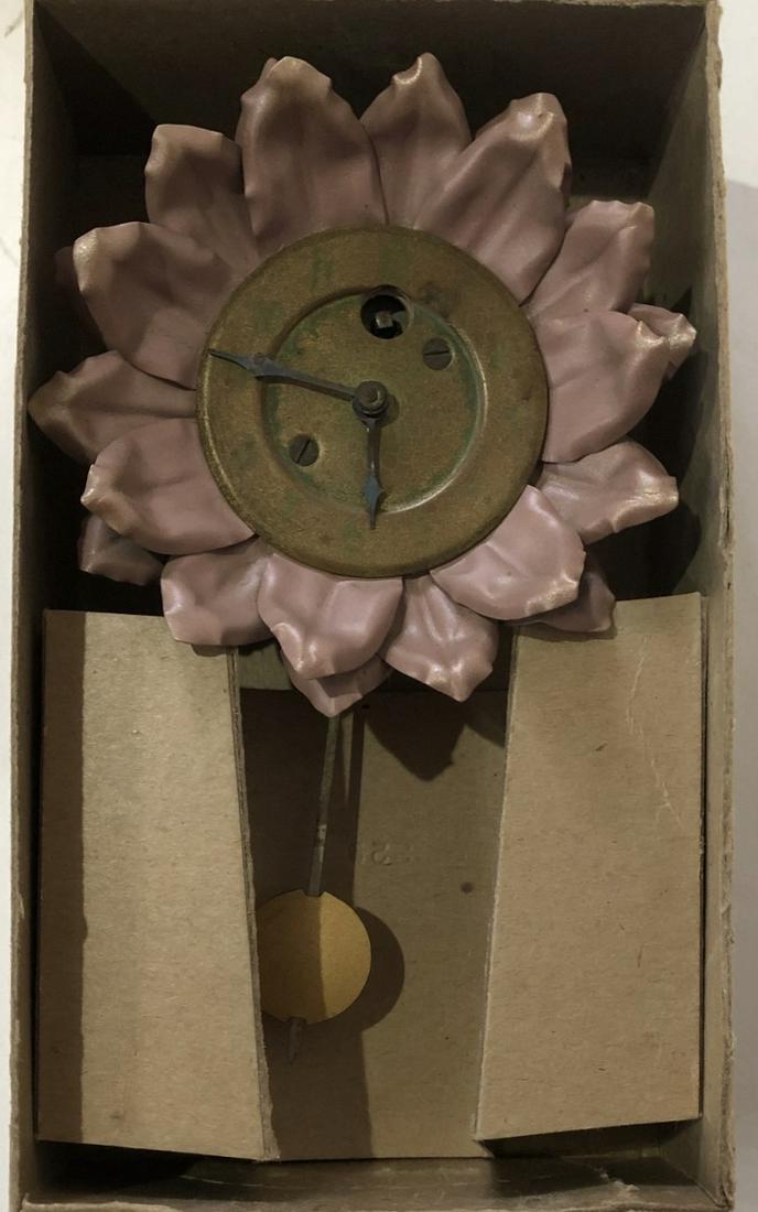 LUX SUNFLOWER PENDULETTE WALL CLOCK: THE LUX CLOCK MFG. CO. WATERBURY CONN. U.S.A. - NO. 329 - CIRCA 1930 - 6" HIGH X 3 3/4" WIDE