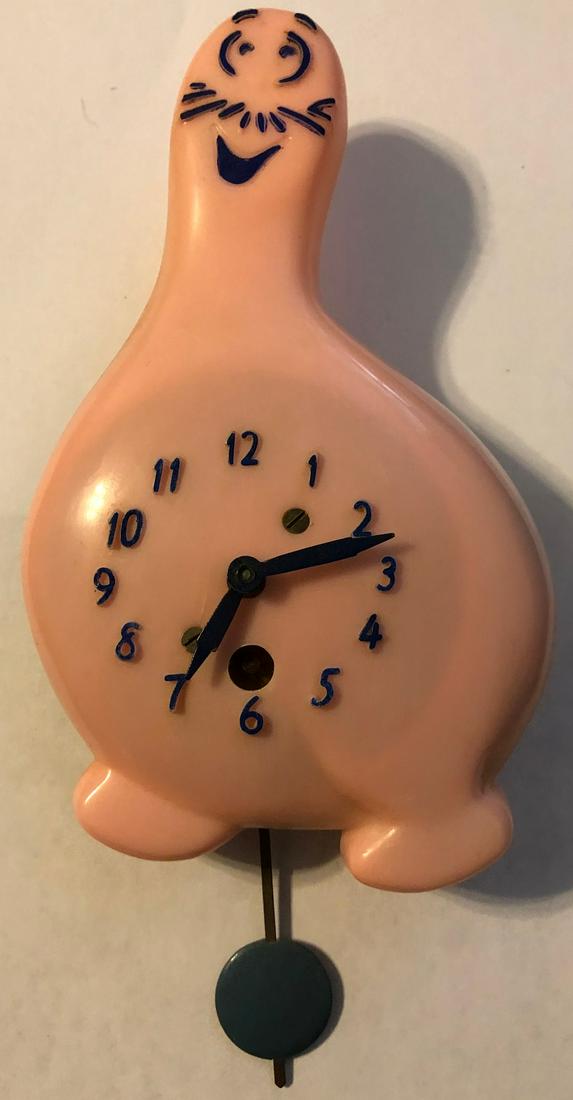 LUX PINK SHMOO (AL CAPP: LUX PINK SCHMOO (CREATED BY AL CAPP IN LI'L ABNER) PENDULETTE WALL CLOCK - LUX CLOCK MFG. CO. WATERBURY CONN. U.S.A. - NO. 320 CIRCA 1949 - 5" X 7"