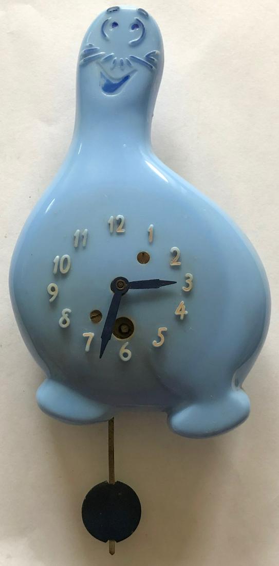 LUX BLUE SHMOO (AL CAPP: LUX BLUE SCHMOO (CREATED BY AL CAPP IN LI'L ABNER) PENDULETTE WALL CLOCK - LUX CLOCK MFG. CO. WATERBURY CONN. U.S.A. - NO. 320 CIRCA 1949 - 5" X 7"