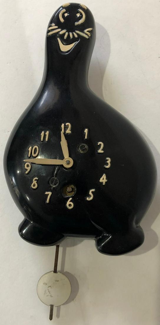 RARE LUX BLACK SHMOO (AL CAPP'S LI'L ABNER) PENDULETTE: RARE (POSSIBLY UNIQUE / SPECIAL ORDER) LUX BLACK SCHMOO (CREATED BY AL CAPP IN LI'L ABNER) PENDULETTE WALL CLOCK - LUX CLOCK MFG. CO. WATERBURY CONN. U.S.A. - NO. 320 CIRCA 1949 - 5" X 7"