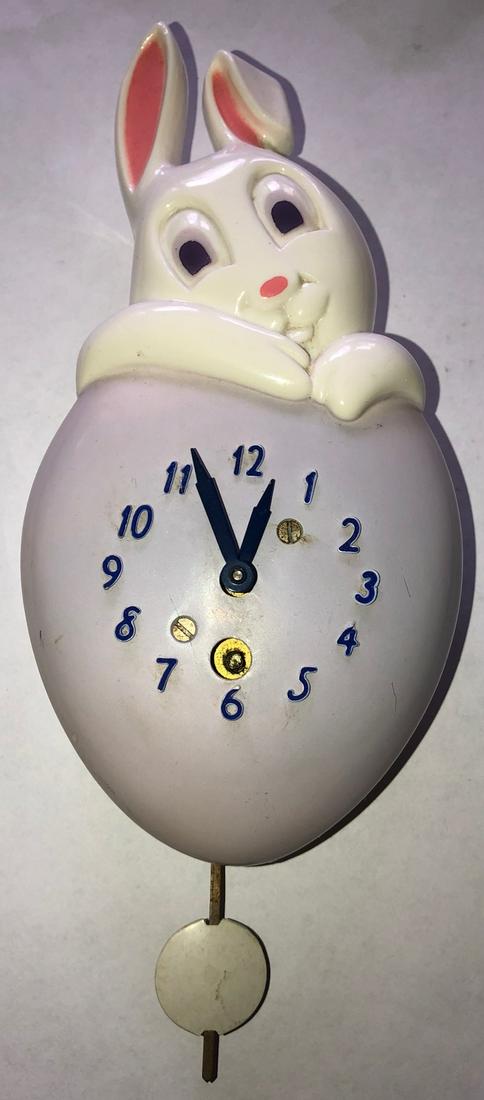 LUX PURPLE HONEY BUNNY RABBIT PENDULETTE CLOCK: LUX PURPLE / LAVENDER HONEY BUNNY RABBIT & HEART PENDULETTE WALL CLOCK - LUX CLOCK MFG. CO. WATERBURY CONN. U.S.A. - NO. 321 CIRCA LATE 1940'S - 3 1/2" X 6 1/2"