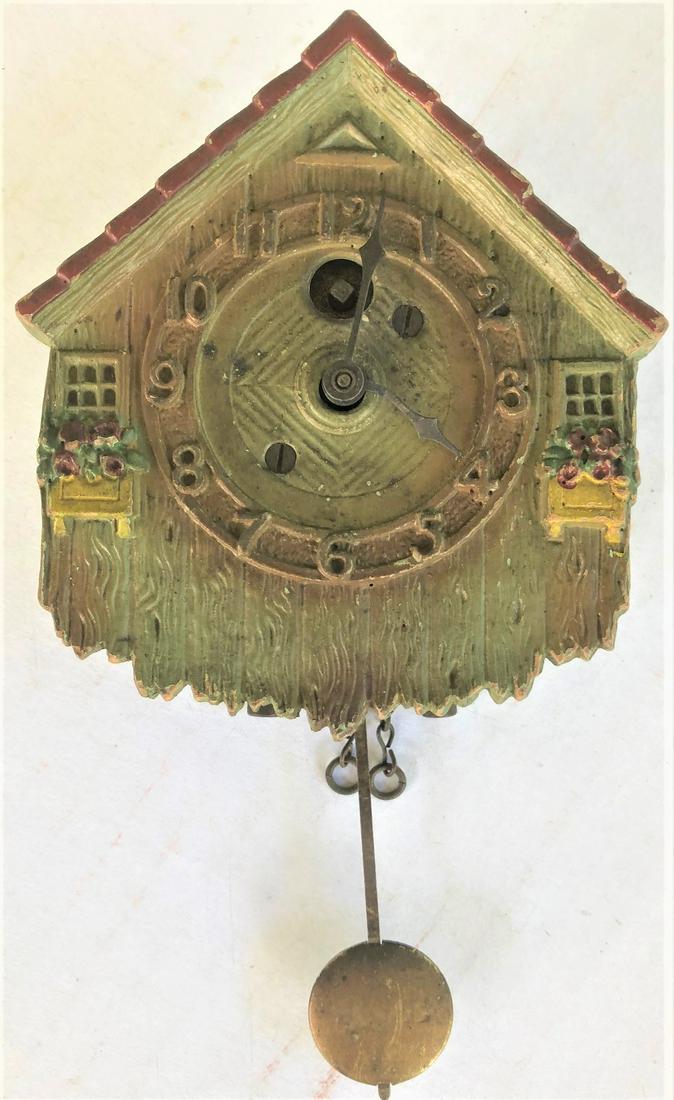 LUX SMALL GREEN COUNTRY HOUSE PENDULETTE CLOCK: LUX SMALL GREEN COUNTRY HOUSE PENDULETTE WALL CLOCK W/ FLOWER BOXES - LUX CLOCK MFG. CO. WATERBURY CONN. U.S.A. - NO. 213 CIRCA 1931 - 3 1/2" X 6 1/4"
