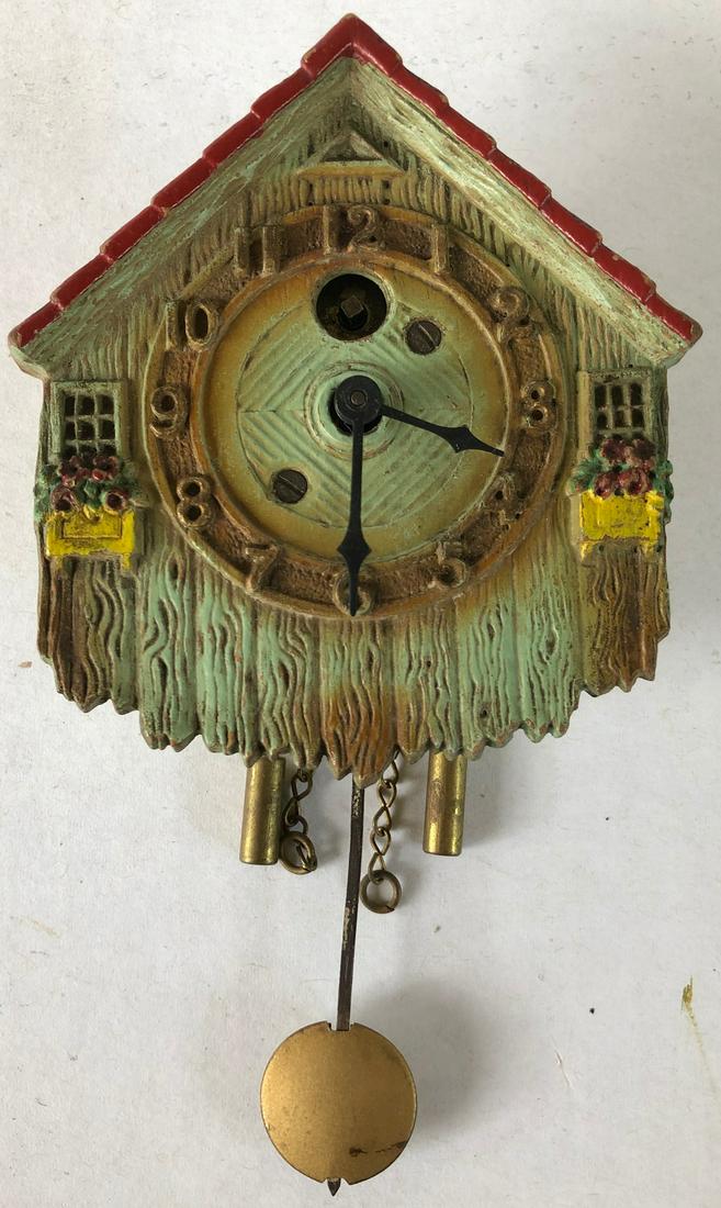 LUX SMALL GREEN COUNTRY HOUSE PENDULETTE CLOCK: LUX SMALL GREEN COUNTRY HOUSE PENDULETTE WALL CLOCK W/ FLOWER BOXES - LUX CLOCK MFG. CO. WATERBURY CONN. U.S.A. - NO. 213 CIRCA 1931 - 3 1/2" X 6 1/4"