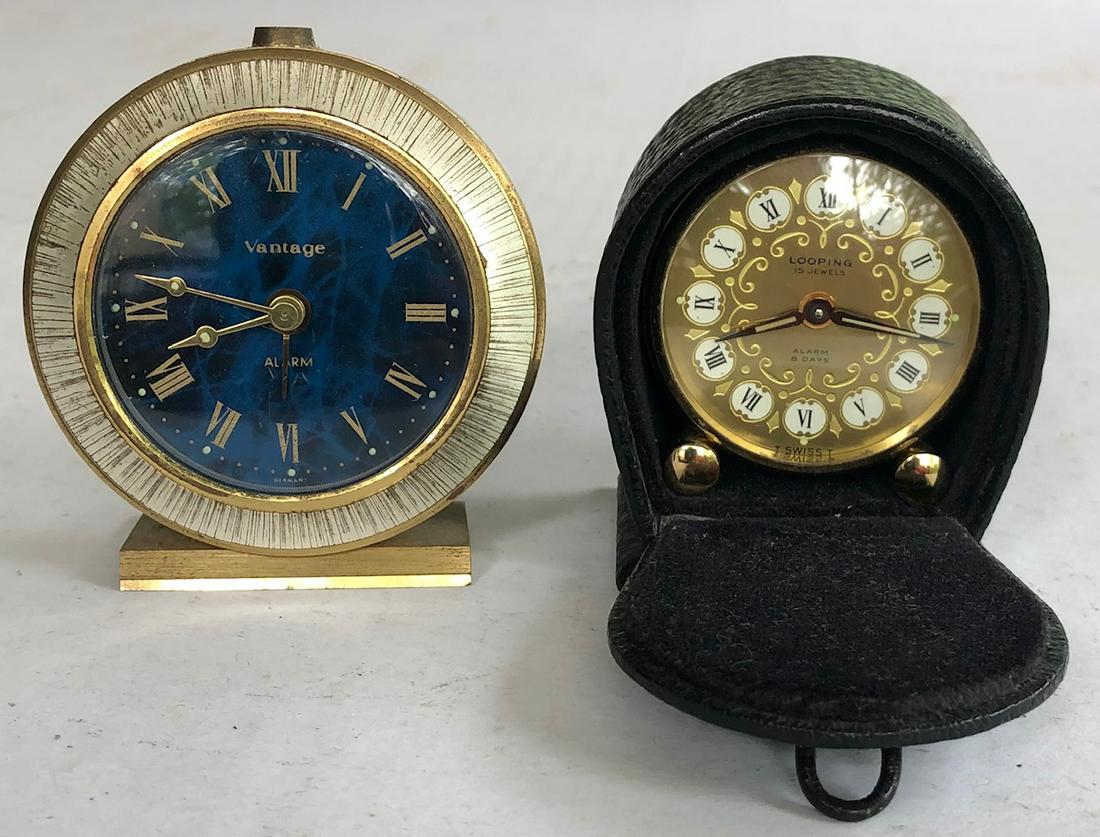 LOT 2 VINTAGE TRAVELING ALARM CLOCKS: ONE "VANTAGE ALARM" GERMANY W/ BLUE DIAL 2 5/8" wide x 2 3/4" high, TOGETHER WITH A SWISS "LOOPING 15 JEWEL" IN ORIGINAL CASE 2 1/2" high x 2 3/16" wide x 1 1/2" deep - BOTH IN GOOD WORKING ORDER