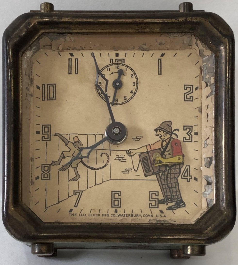 LUX ORGAN GRINDER & MONKEY SHELF / ALARM CLOCK: THE LUX CLOCK MFG. CO. WATERBURY CONN. U.S.A. - CIRCA 1934 - 4 5/8" HIGH X 3 3/4" WIDE