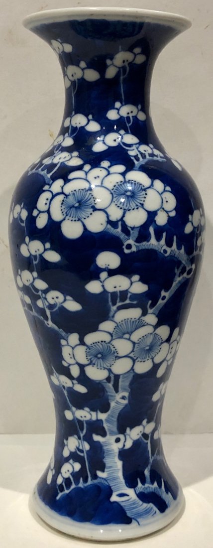 CHINESE PORCELAIN BLUE WHITE PRUNUS BLOSSOM VASE: ANTIQUE CHINESE PORCELAIN BLUE WHITE PRUNUS BLOSSOM VASE DECORATED WITH PRUNUS BLOSSOMS WITH A HONEYCOMB PATTERN AND A FLARED TOP - MARKED / SIGNED ON BOTTOM - DIMENSIONS: 10" HIGH, 3 1/8" DIAMETER TO