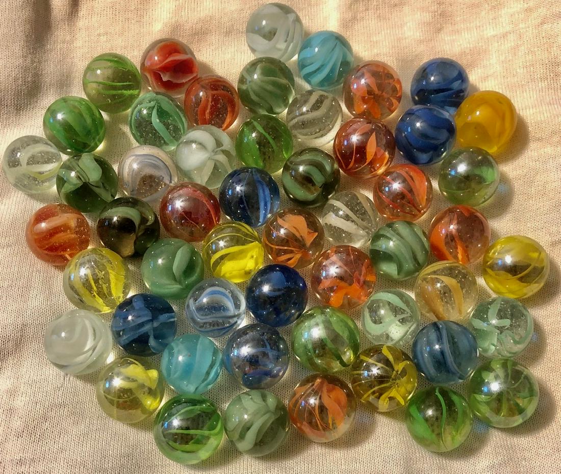LOT 53 VINTAGE / ANTIQUE MARBLES: 7 -9 VEIN (VANE) CATSEYES - VARIOUS COLORS - CONDITION: GOODâ€¦COMMENSURATE WITH AGE AND USE