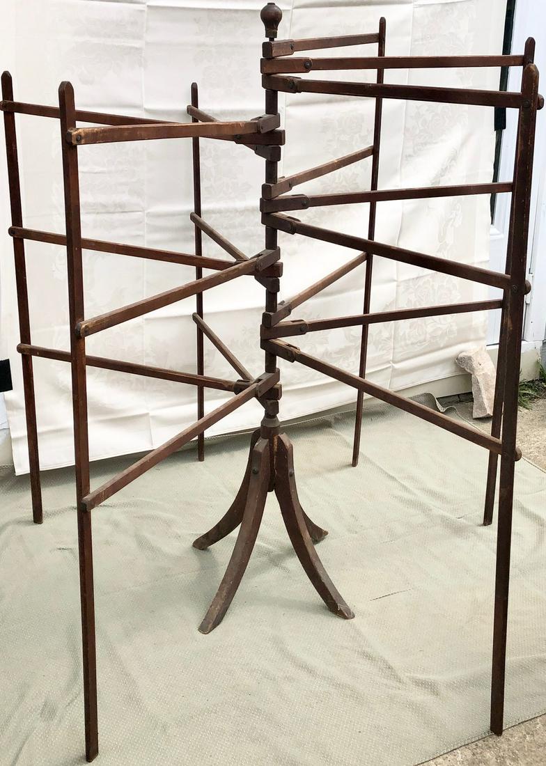 19TH C FOLDING CLOTHES / HERB DRYING RACK: 19TH C 6 SECTION UPRIGHT FOLDING CLOTHES / HERB DRYING RACK - 4 LEG BASE WITH A CENTRAL WOODEN ROD THAT SUPPORTS 6 SWINGING / ROTATING RACKS, EACH WITH 3 HORIZONTAL DRYING BARS - ***NOTE - THIS ITEM R