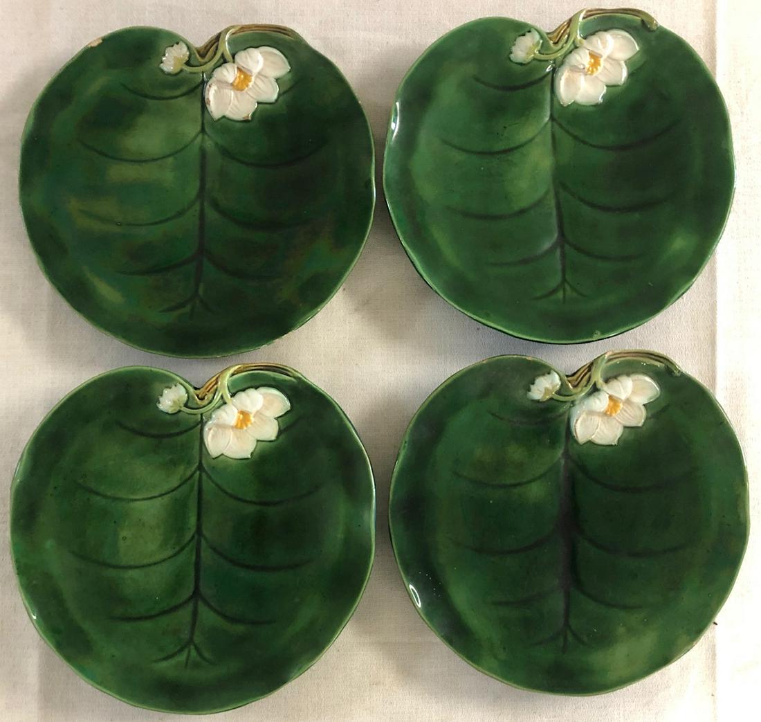 SET 4 MAJOLICA GEORGE JONES WATER LILY PLATES: SET 4 MAJOLICA GEORGE JONES WATER LILY PLATES - IMPRESSED REGISTRY MARKS AND GJ (GEORGE JONES) MONOGRAM - ONE HAS A TIGHT HAIRLINE, ONE HAS A SMALL CHIP (SEE PHOTOS) OTHER 2 EXCELLENT CONDITION WITH N