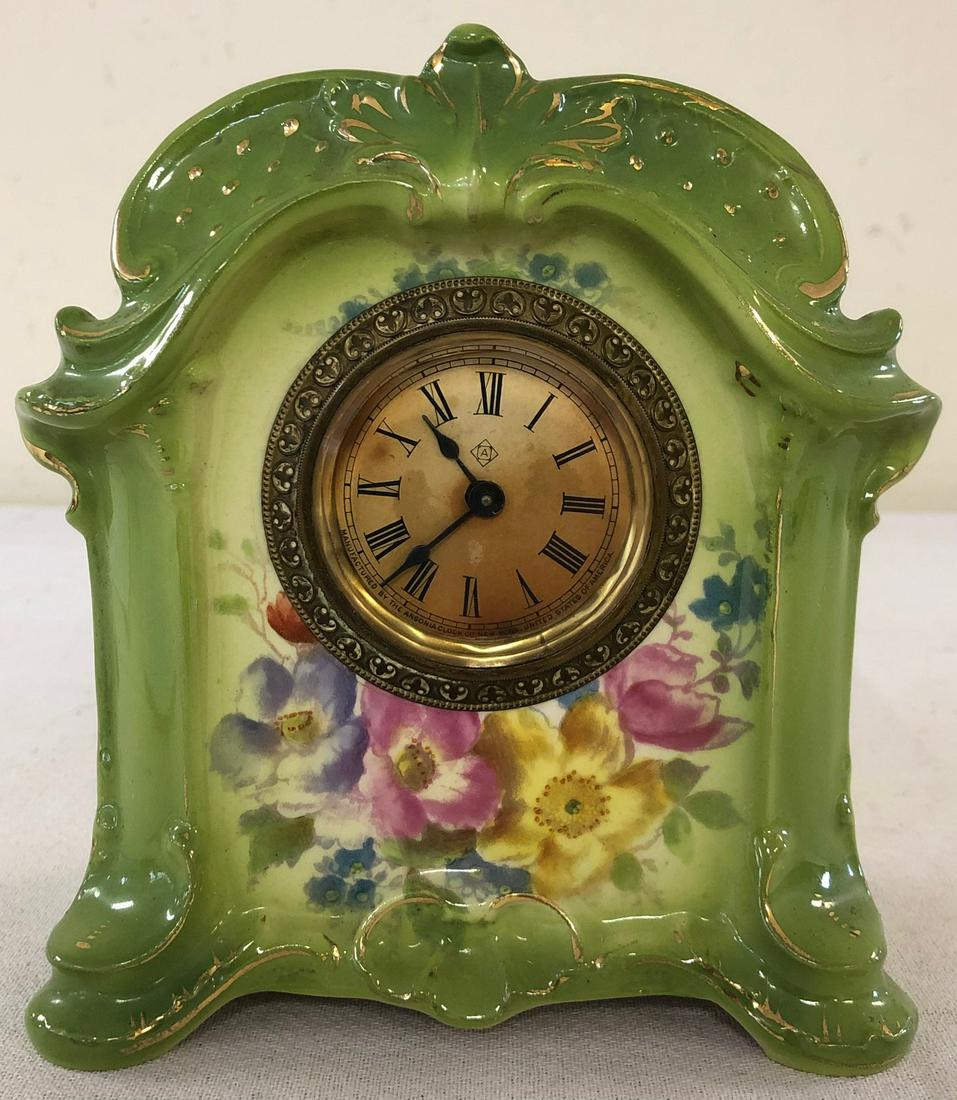 MINIATURE GERMAN ROYAL BONN PORCELAIN SHELF CLOCK: GERMAN "GLORY" PATTERN ROYAL BONN CLOCK MARKED ON BACK WITH ROYAL BONN LOGO - IMPRESSED #2740 DR - GREEN WITH GILT HIGHLIGHTS AND FLORAL DECORATION - WORKING WHEN TESTED - NO CHIPS, CRACKS OR REPAIRS 