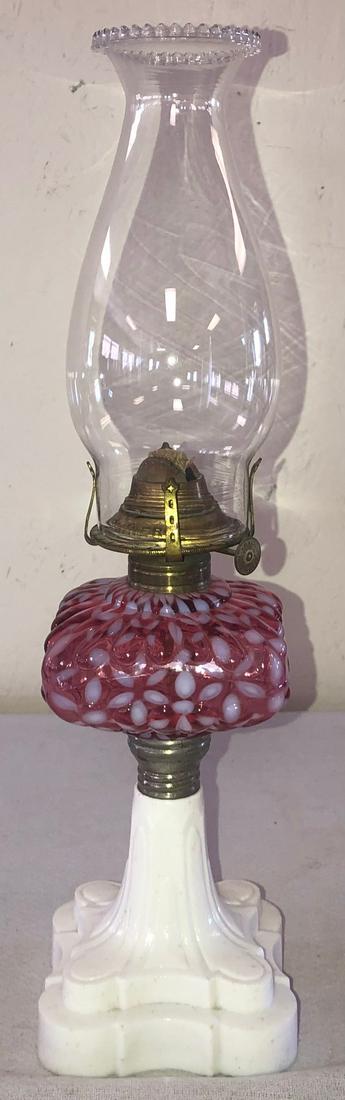 CRANBERRY OPALESCENT SNOWFLAKE PEDESTAL BASE OIL LAMP: CRANBERRY OPALESCENT "SNOWFLAKE" PEDESTAL BASE OIL LAMP WITH OPAQUE WHITE BASE, BRASS BURNER, SIGNED CHIMNEY "PEARL TOP MACBETH CO. PITTSBURGH USA" - 16 1/4" HIGH INCLUDING CHIMNEY - MINOR ROUGHNESS T