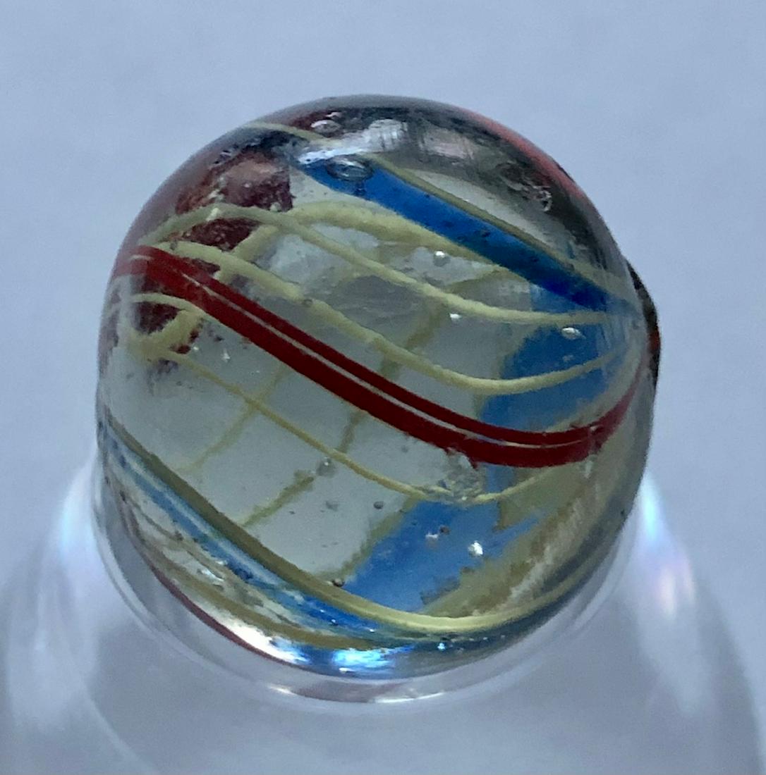11/16" ANTIQUE GERMAN SWIRL LATTICINIO CORE MARBLE: 11/16" ANTIQUE GERMAN SWIRL LATTICINIO CORE MARBLE WITH AN EXPANDED WIDE YELLOW LATTICINIO CORE, SURROUNDED BY RED, BLUE & YELLOW OUTER SWIRL BANDS - DOES HAVE A FLAT 1/4" CHIP TO SURFACE