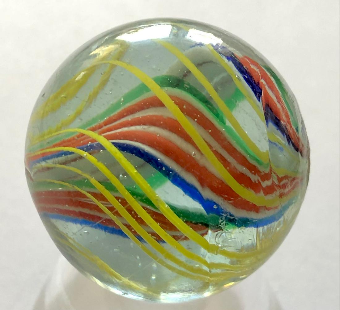 1 1/8" ANTIQUE GERMAN RIBBON CORE MARBLE: 1 1/8" ANTIQUE GERMAN TRIPLE RIBBON CORE MARBLE CAGED IN YELLOW SWIRLS - 3 RIBBONS IN RED, WHITE, BLUE & GREEN ALL CAGED IN OUTER YELLOW SWIRLS - BEAUTIFUL CONDITION WITH MINOR TO NO SURFACE WEARâ€