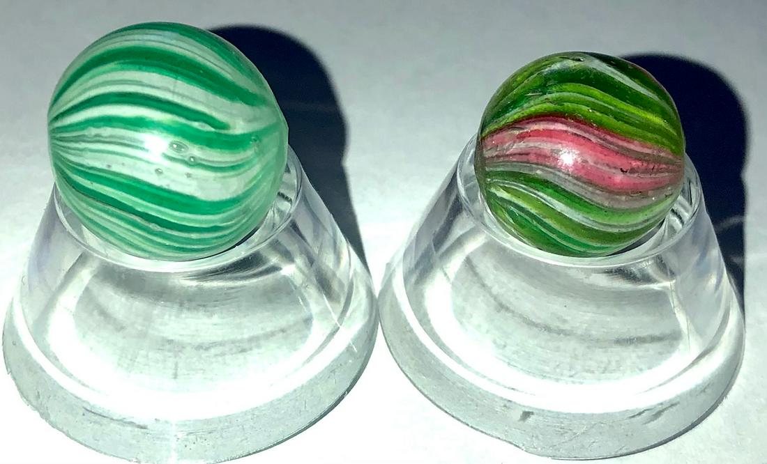 LOT 2 ANTIQUE GERMAN ONIONSKIN MARBLES: LOT 2 ANTIQUE GERMAN ONIONSKIN MARBLES - 19/32" GREEN, PINK & WHITE 4 PANEL ONIONSKIN, 21/32" GREEN & WHITE ONIONSKINâ€¦BOTH IN VERY GOOD CONDITIONâ€¦GREEN & WHITE WITH AN 'INDENTION' MAYBE FR