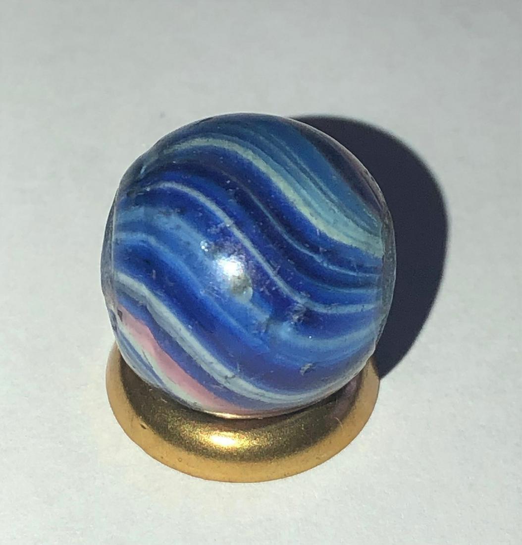 ANTIQUE GERMAN END-OF-DAY ONIONSKIN MARBLE: ANTIQUE GERMAN END-OF-DAY ONIONSKIN MARBLE IN 'RED', WHITE & VARIOUS SHADES OF BLUE - 9/16" - MINOR SURFACE WEAR