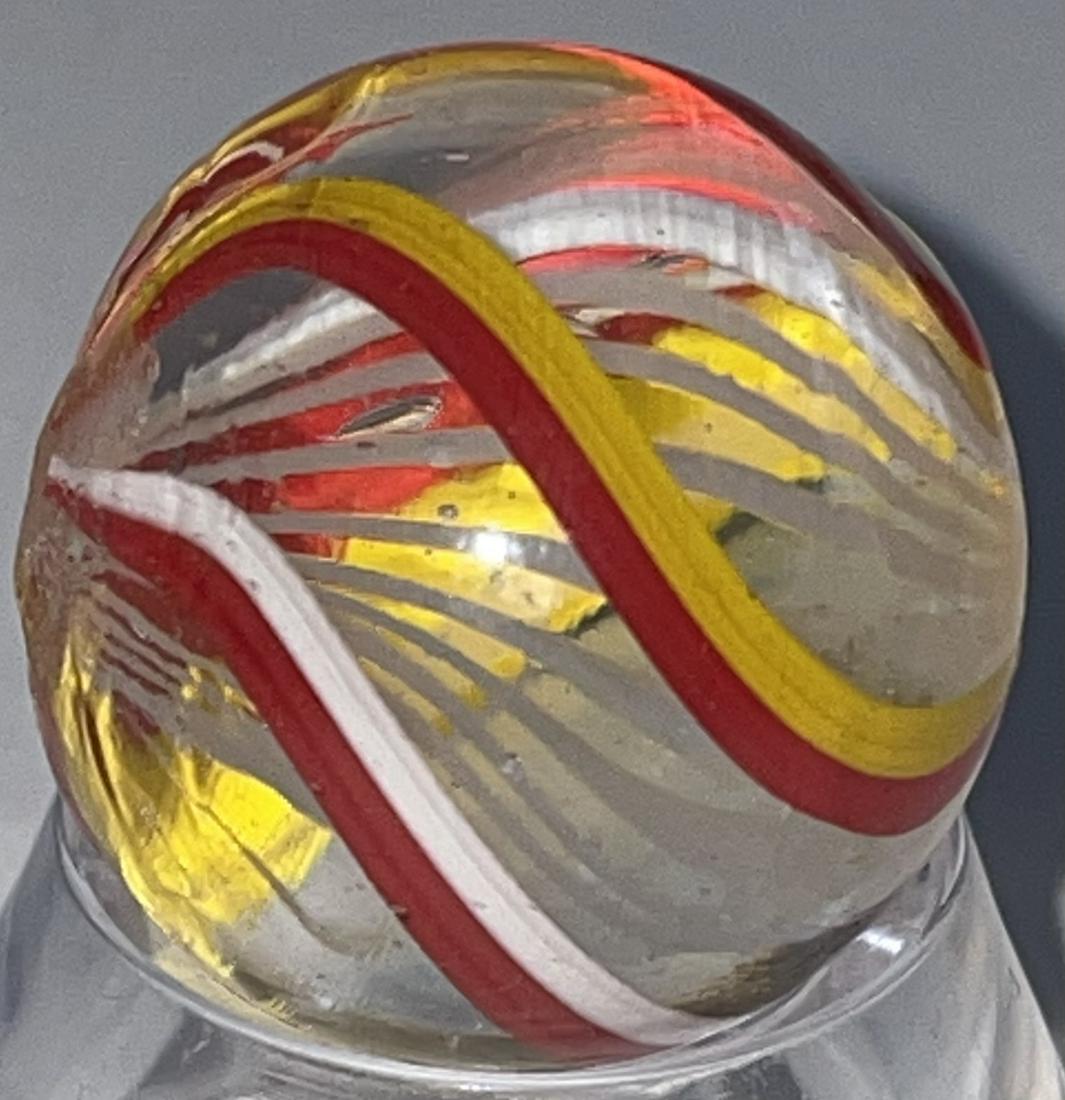 ANTIQUE GERMAN SWIRL LATTICINIO CORE MARBLE: ANTIQUE GERMAN SWIRL WHITE LATTICINIO CORE MARBLE WITH ALTERNATING RED & YELLOW AND RED & WHITE OUTER SWIRLS - VERY GOOD CONDITION WITH MINOR SURFACE WEAR - 25/32"