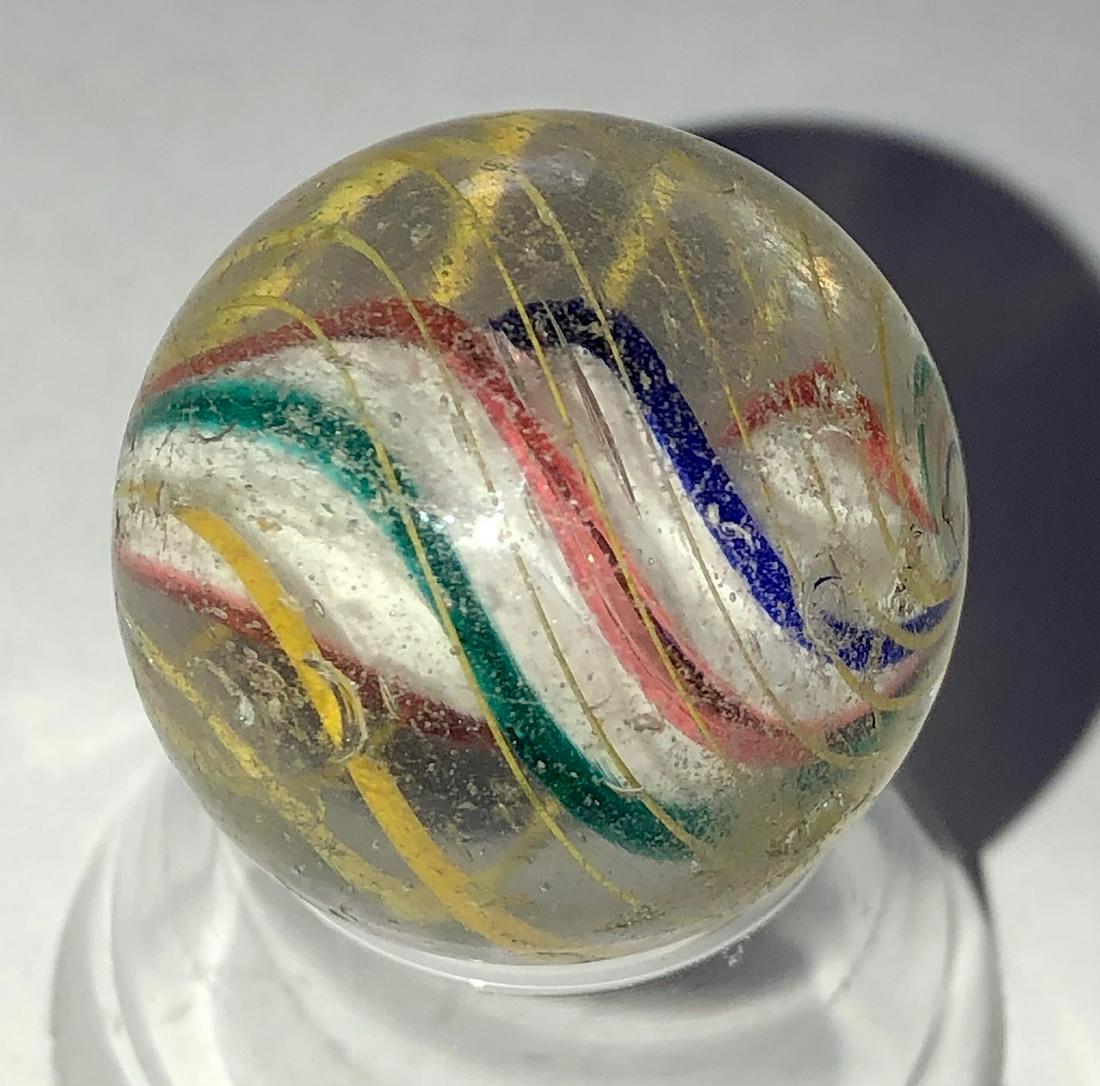 ANTIQUE GERMAN 3 STAGE SWIRL MARBLE: ANTIQUE GERMAN 3 STAGE SWIRL MARBLE WITH A SOLID WHITE CORE SURROUNDED BY BLUE, RED & GREEN SWIRLS AND YELLOW OUTER LATTICINIO SWIRLS - WITH SURFACE WEAR - 29/32"