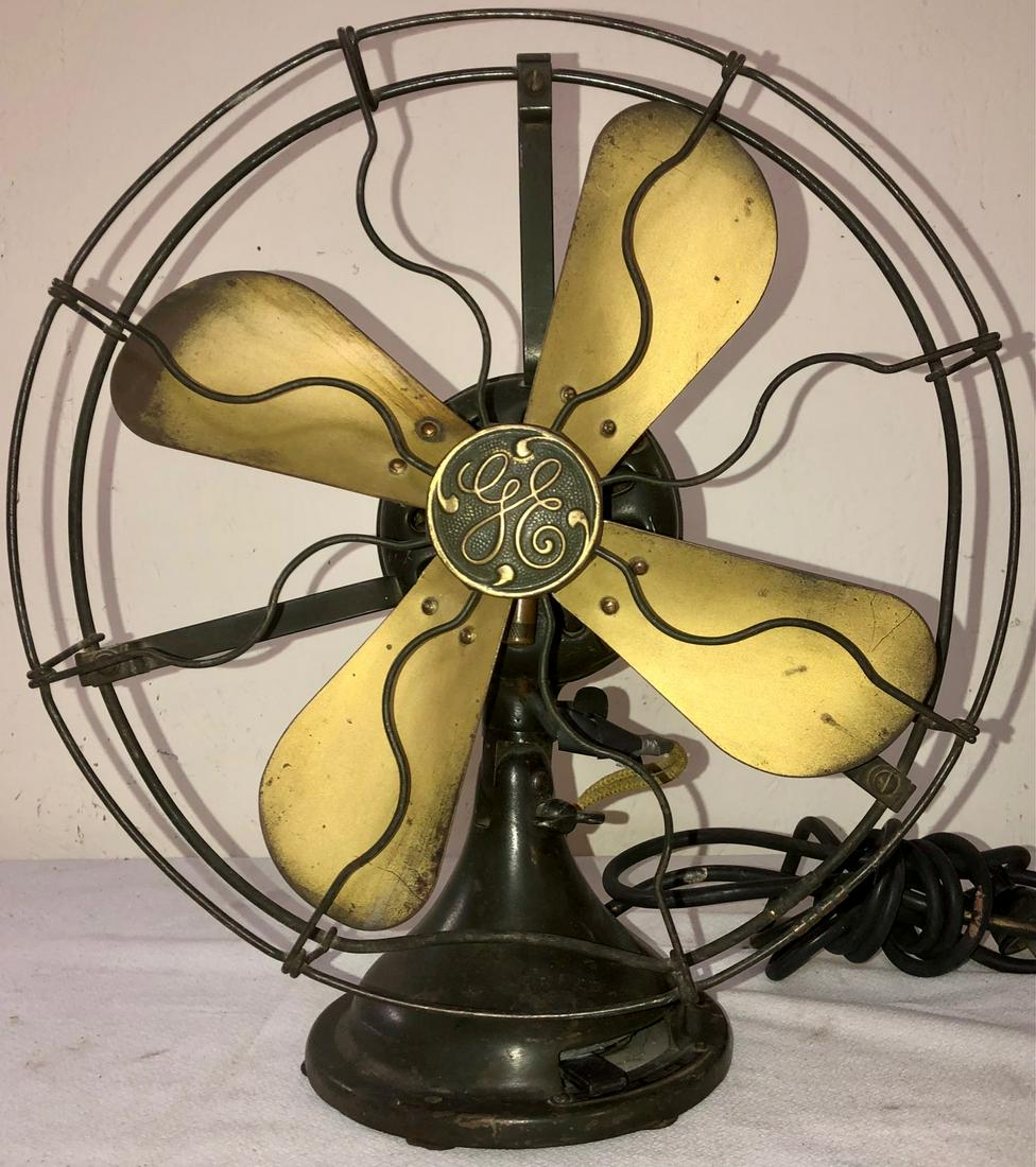 ANTIQUE GENERAL ELECTRIC BRASS BLADE FAN: WORKING WHEN TESTED - ANTIQUE GENERAL ELECTRIC BRASS BLADE FAN WITH METAL CAGE - ORIGINAL BRASS TAG READS "ALTERNATING CURRENT FAN MOTOR / GENERAL ELECTRIC CO., U.S.A. / NO. 1220706 / CAT. 34017 / TYP